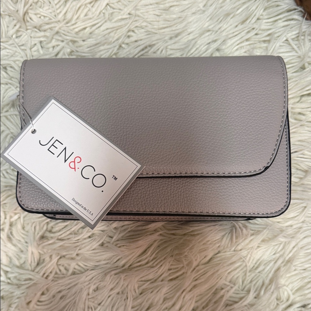 Jen &Co crossbody bag with black and white strap. NWT